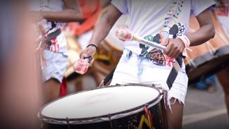 a close up of a person drumming