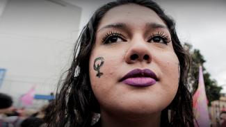 Close up of a woman's face at a rally