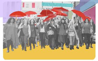 a group of women holding red umbrellas