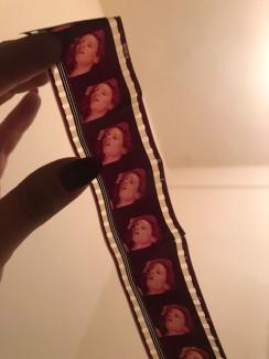 Photo of a person holding porn film reel