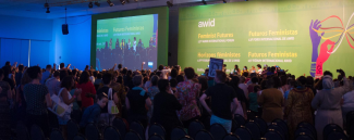 Image of the crowd looking at the stage during a past AWID Forum