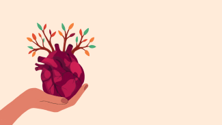 An illustration showing a hand holding a human heart out of which branches with colorful leaves sprout